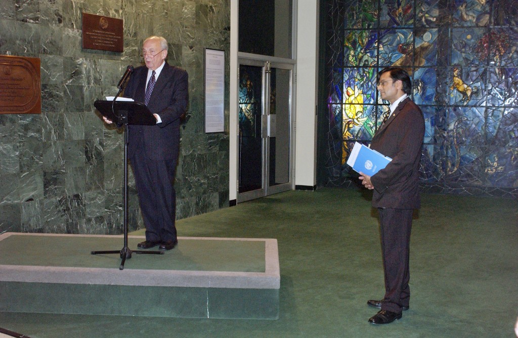 UN Photo/Paulo Filgueiras : Vladimir Petrovsky (left), former Director-General of the UN in Geneva and President of the Disarmament Conference, speaks at a ceremony to dedicate the completed restoration project of the Peace Window by Marc Chagall, which was installed at the United Nations in honour of Dag Hammarskjöld in 1964. Next to him is Shashi Tharoor, Under-Secretary-General for Communications and Public Information. The ceremony was part of the events held today to mark the 60th anniversary of the United Nations. 25 October 2005 United Nations, New York Photo # 100054 